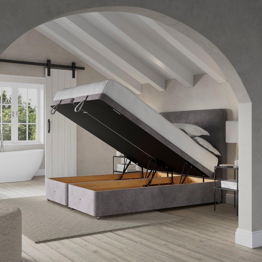 a bed with a large open storage compartment in the middle of it
