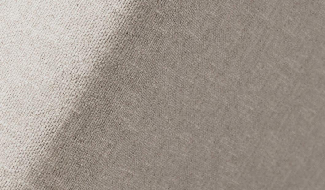 a close up of a white fabric with a small hole in it