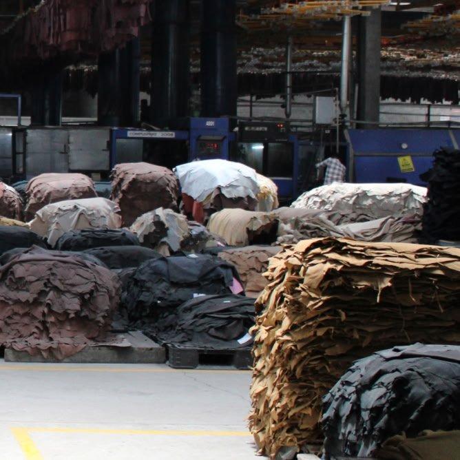 a warehouse filled with many different types of fabric and clothing
