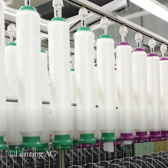 a machine that is filled with white and purple thread