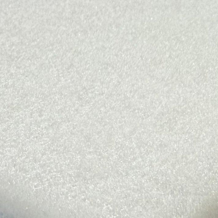 a close up of a white sheet of fabric with a black border
