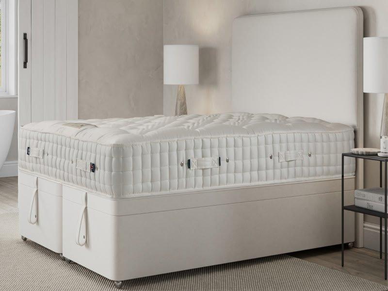 a stack of four mattresses stacked on top of each other