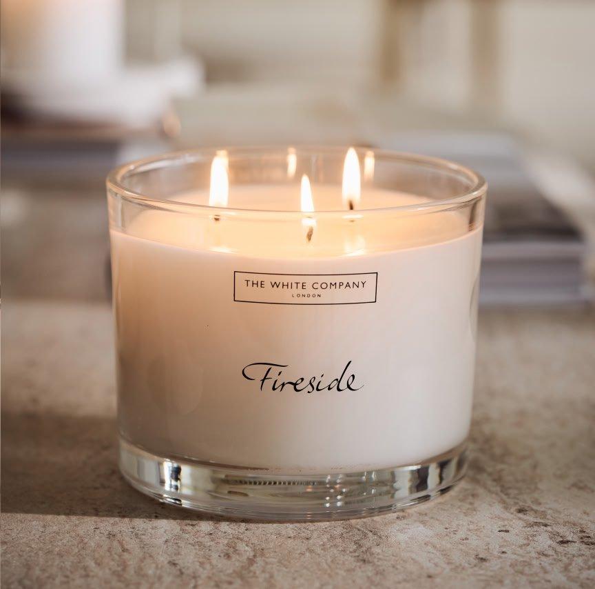 a candle with the words firestone on it