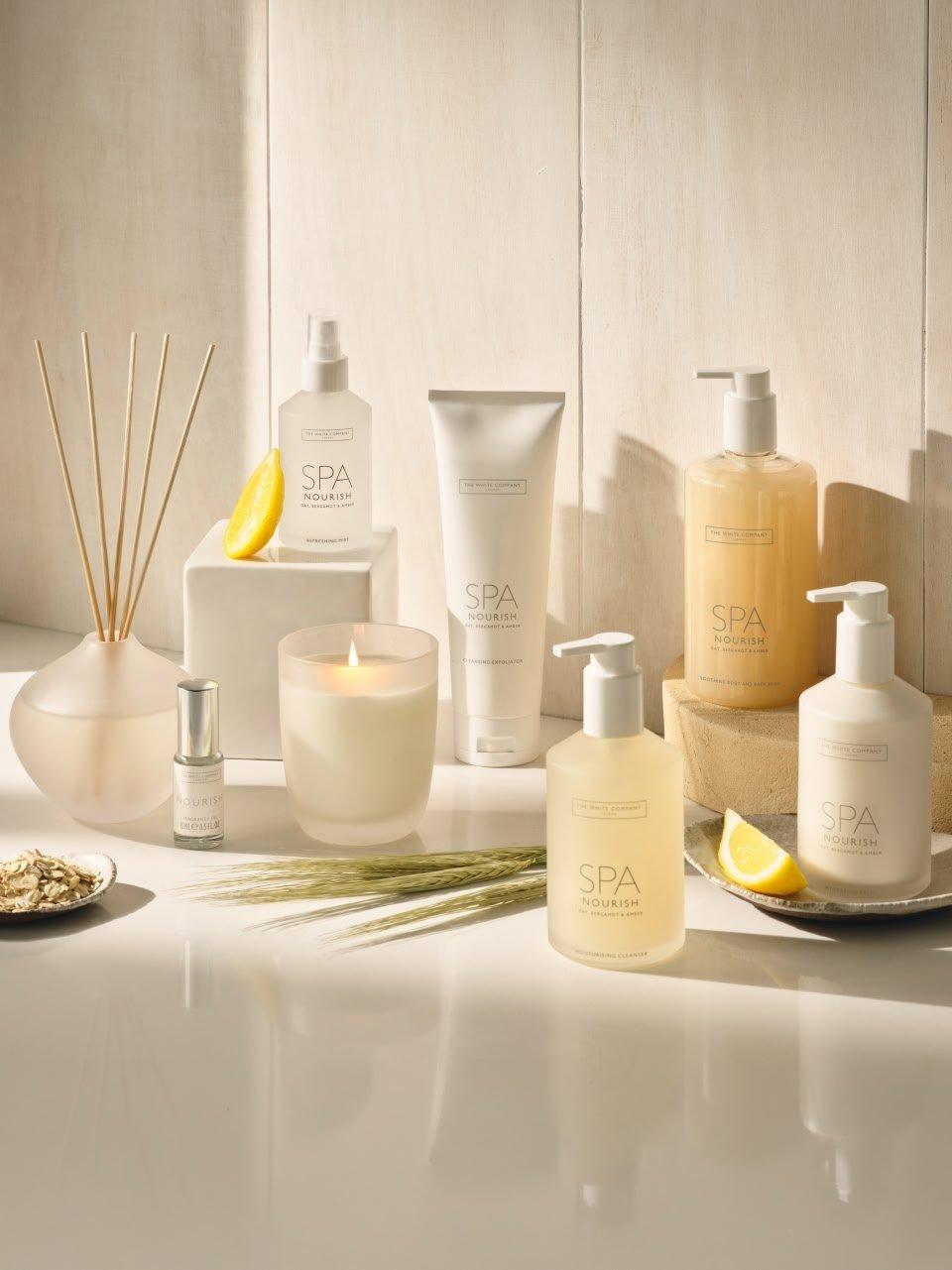 a white counter with a variety of spa products on it