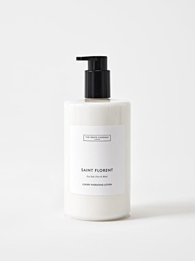 a bottle of body lotion on a white background