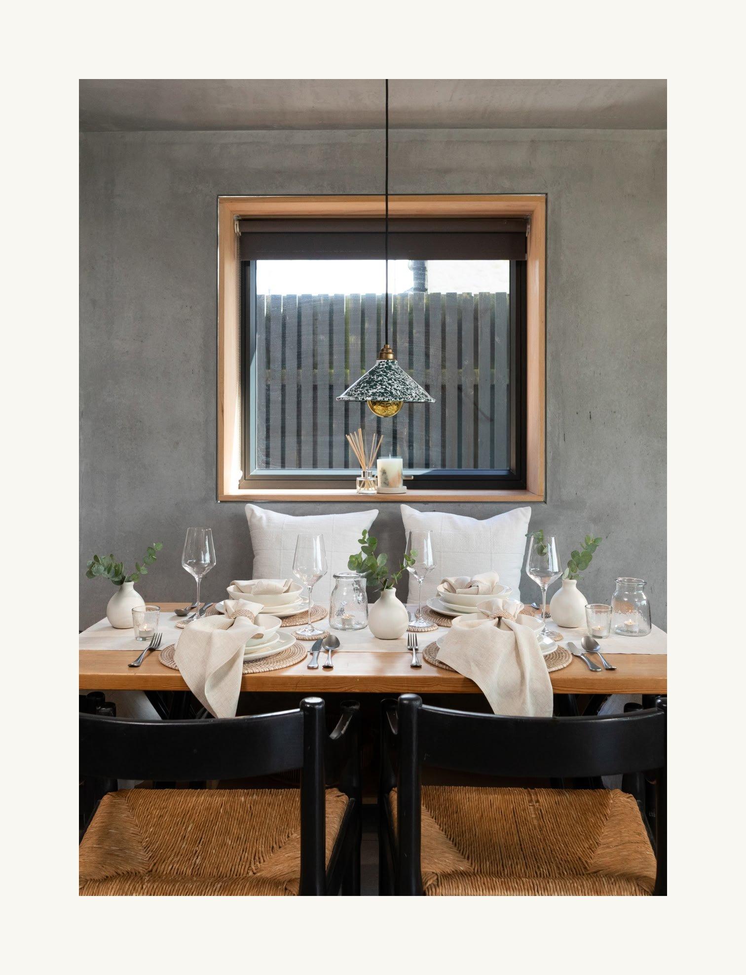 a table with plates and cups and a lemon on it