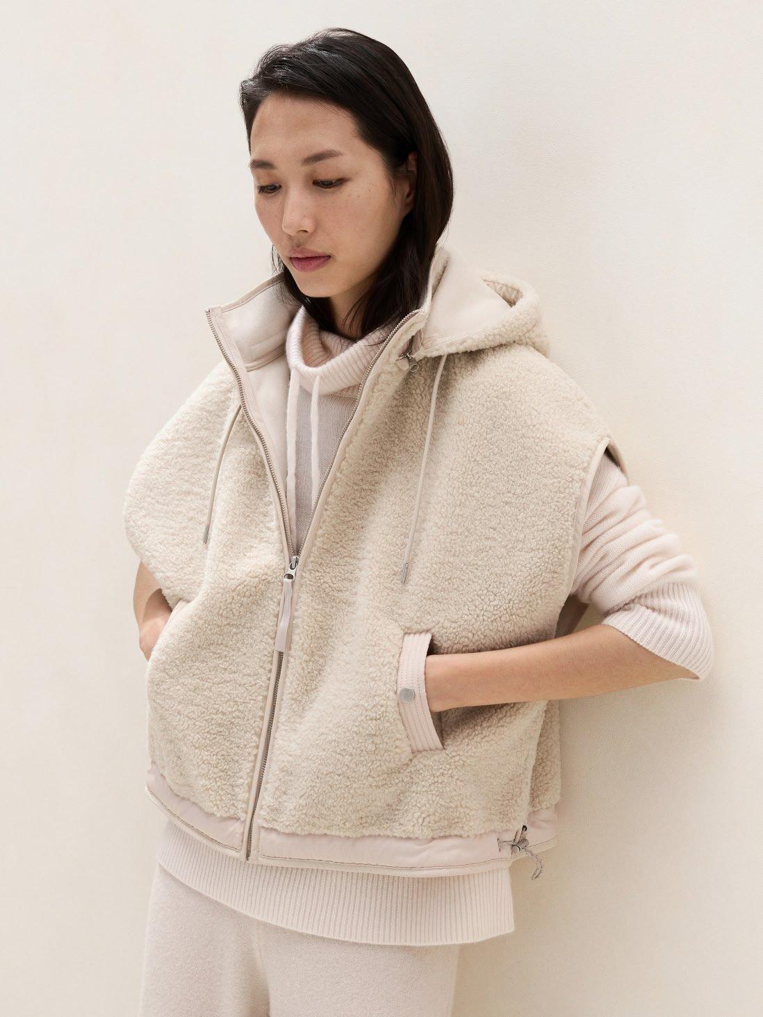 woman in hooded borg jacket