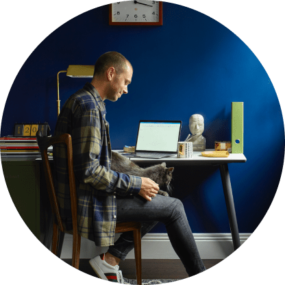a man sitting at a desk in a circle