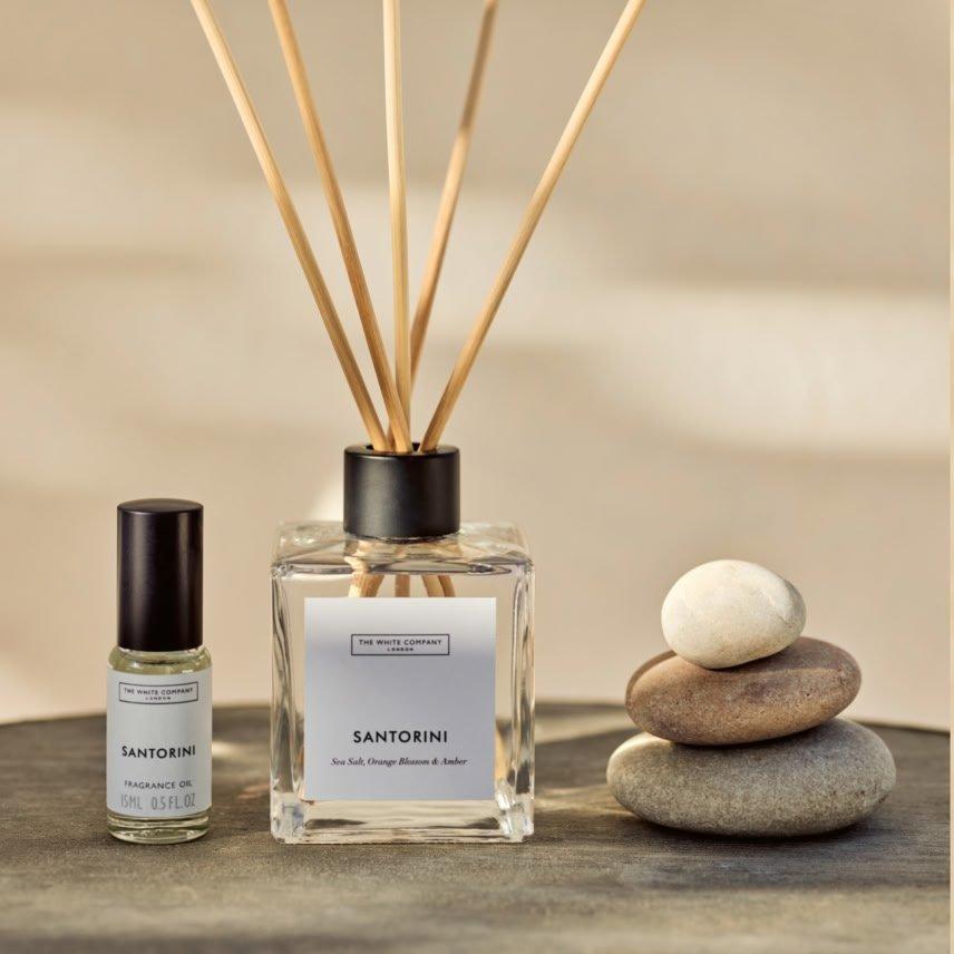 a close up of a bottle of perfume and a bottle of perfume